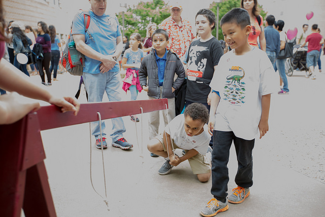 Children play with physics ropes at the Festival.