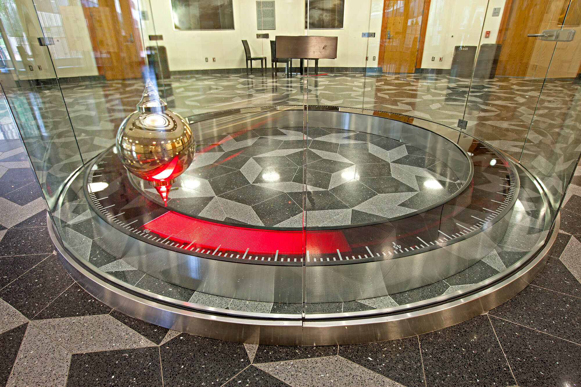 This huge pendulum seems to be rotating on it’s own plane of oscillation, but is it?